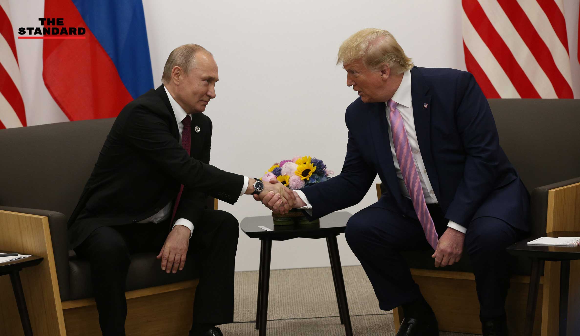 Smirking Trump jokes to Putin
