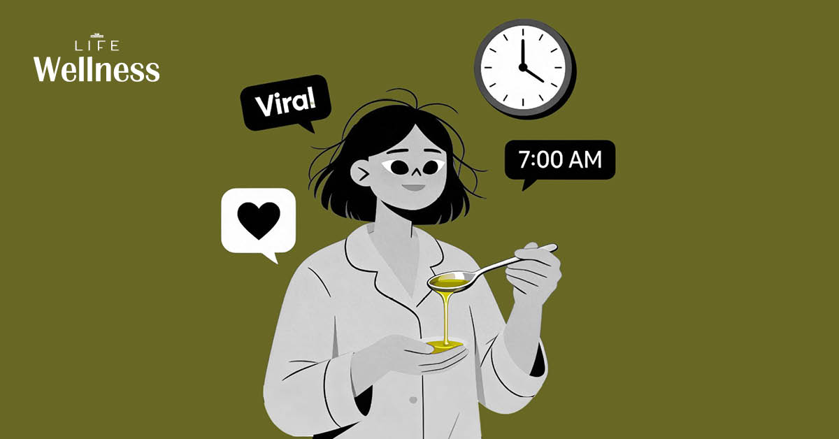 ภาพน้ำมันมะกอกในช้อน พร้อมข้อมูลเกี่ยวกับกระแสไวรัลการดื่มเพื่อสุขภาพและคำแนะนำจากผู้เชี่ยวชาญ