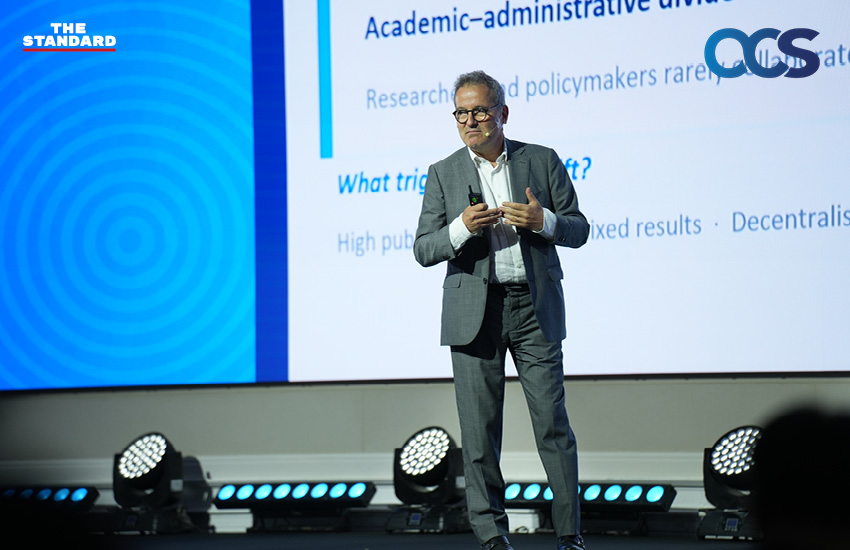 ภาพบรรยากาศงาน OCS Symposium 2026 พร้อมข้อความ 'เวทีรวมมุมมองระดับโลก สู่การออกแบบกฎหมายแห่งอนาคตของไทย' 3