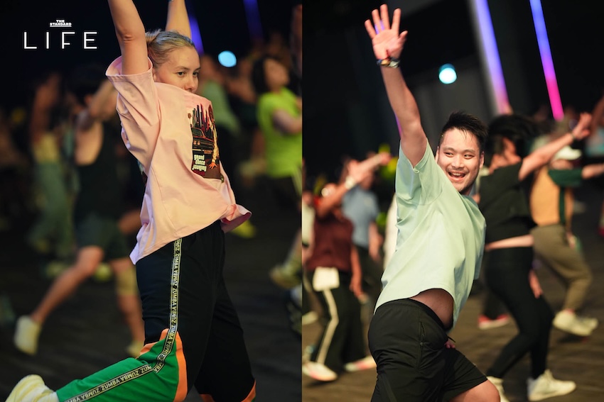 ภาพบรรยากาศงาน LES MILLS LIVE Bangkok 2026 x adidas ที่มีผู้คนจำนวนมากกำลังออกกำลังกายในฮอลล์ขนาดใหญ่ 7